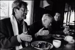 Chinary Ung, facing right, Ben Johnston, looking down & John Schneider, looking at Ung, (l to r), heads and shoulders portrait, seated at dining table, Woodside CA, (2009)