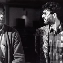 Anthony Braxton and Charles Amirkhanian, heads and shoulders portrait, looking at each other, San Francisco, 1985