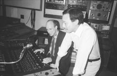 Brian Eno at the control board in the KPFA studio with engineer Michael Yoshida, 1988