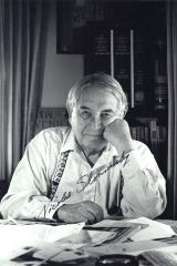 An autographed portrait of musicologist Nicolas Slonimsky, seated at desk (ca.1988)