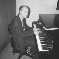Brian Eno at the piano in the KPFA studios during the Brian Eno Day Marathon, 1988