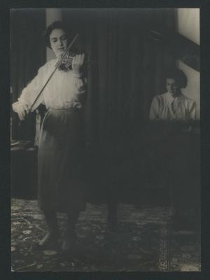 Portrait of Anahid Ajemian, standing, playing violin, and Maro Ajemian seated at the piano (1954)
