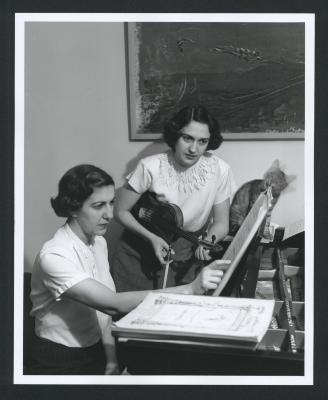 Portrait of Piano and Violin Duo Maro and Anahid Ajemian, rehearsing at home (ca. 1950s)