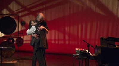 Clark Coolidge and Alvin Curran hug onstage after a performance at OM 23, San Francisco CA (2018)