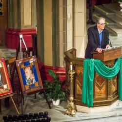 Charles Amirkhanian at the podium during introductions to OM 22 inside the Mission Dolores Basilica, San Francisco CA (February 18, 2017)