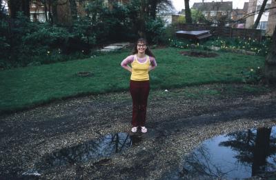 Annea Lockwood standing in her backyard, Ingatestone (1972)