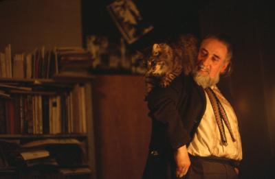 Bob Cobbing looking at his cat on his shoulder, London (1972) 