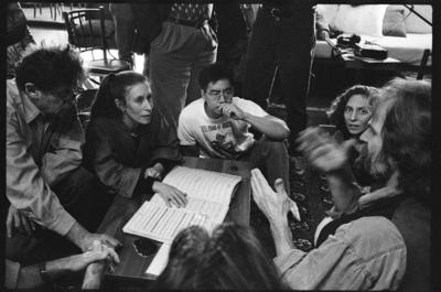 Philip Glass, Meredith Monk, Jon Jang, Julia Wolfe, and Trimpin, seated around a musical score, ver.2, 1993