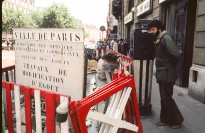 Charles Amirkhanian observing a work area for a sewer modification, Paris, France, 1976
