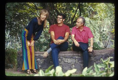Full length portrait of Carol Law, Charles Amirkhanian, and Conlon Nancarrow, in Nancarrow's garden, 1969