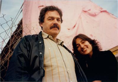 A half length portrait of John and Sylvia White, standing by a fence, Los Angeles, 1983