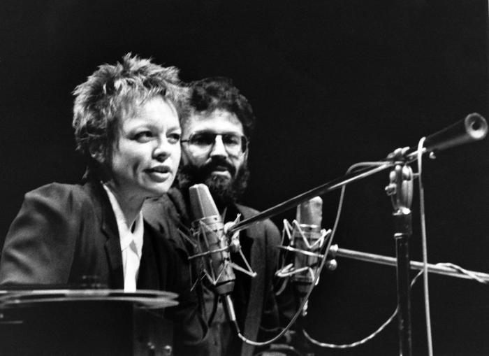Laurie Anderson talks as Charles Amirkhanian listens during an appearance at the Palace of Fine Arts Theater, San Francisco, Dec. 6, 1984