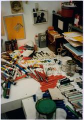 A work desk covered with pens and markers in the studio of John White, Los Angeles, 1983